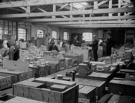 An old picture of a cigar factory.